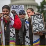 Fight Poverty, Not the Poor sign and people