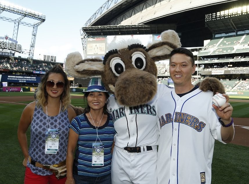 Mike Clark with wife, Emily, mother, Mitsu Clark, and the Mariner Moose