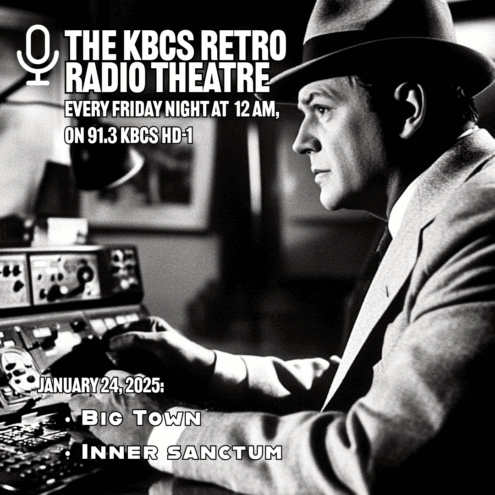 Black and white image of man at controls in suit and hat