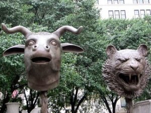 Two Ai Weiwei sculptures of Zodiac animals in outdoor space.
