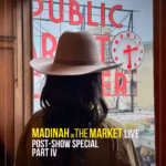 Madinah, wearing a hat with her back to us, looks at the Pike Place Market sign