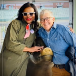 Madinah Slaise smiles next to Rachel Ligtenberg, President & CEO of the Pike Place Market Preservation and Development Authority